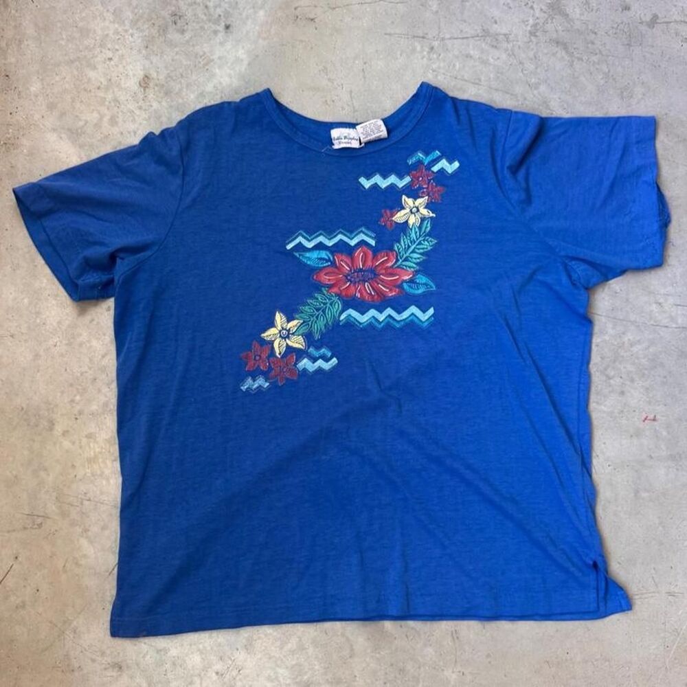 Blue Hawaiian shirt with floral and wave design